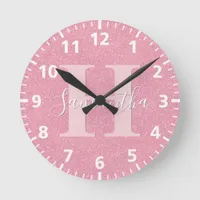 Pink rose gold glitter monogram name round clock