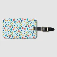 Summer beach with starfish, shells and pebbles luggage tag